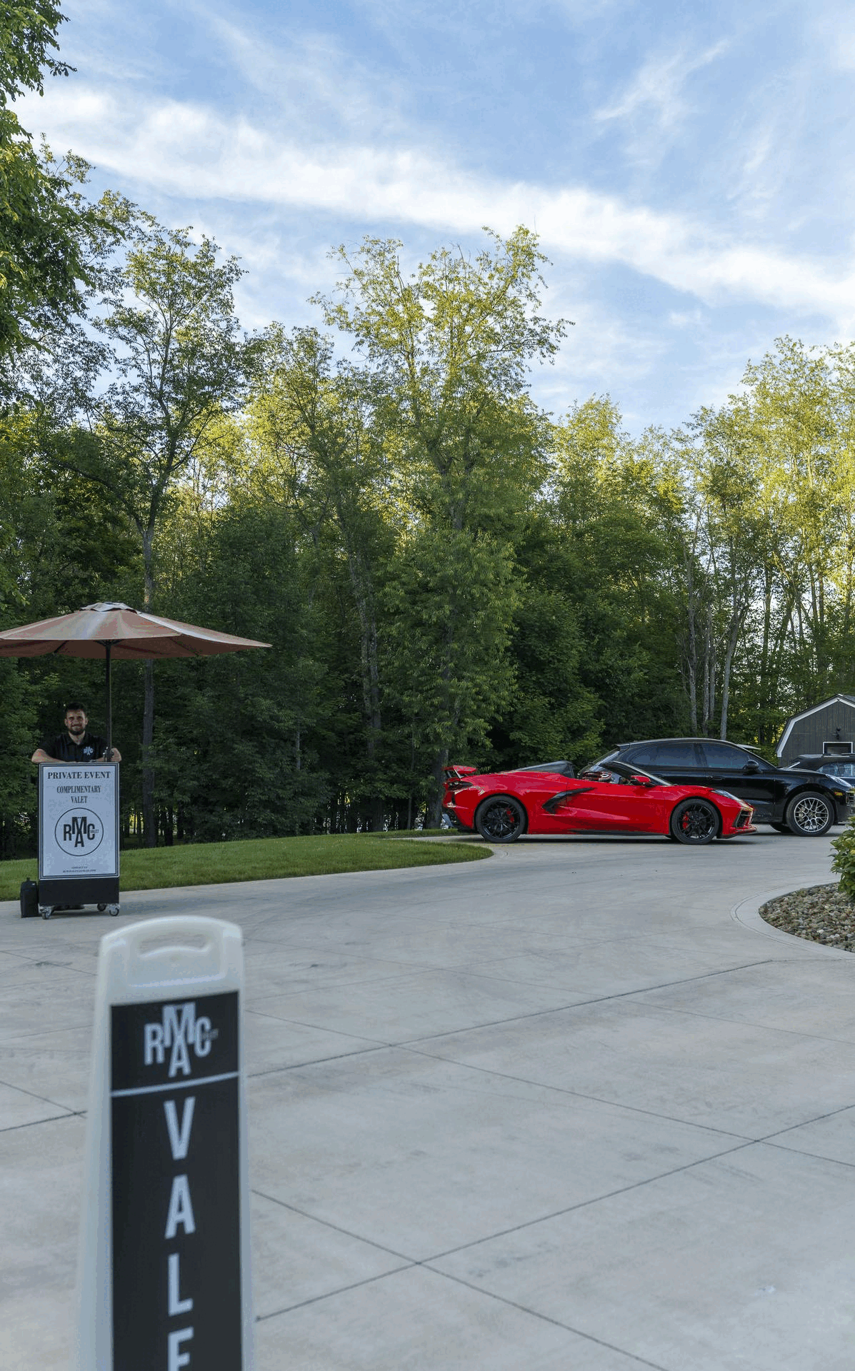 RCMA Valet showcases premier valet services at a private event, featuring a sleek red Corvette and our signature valet booth. Our valet team provides exceptional care and professionalism, ensuring a seamless parking experience for luxury vehicles at upscale gatherings across Cleveland. RCMA Valet’s commitment to high standards makes us the preferred valet service provider for exclusive events.